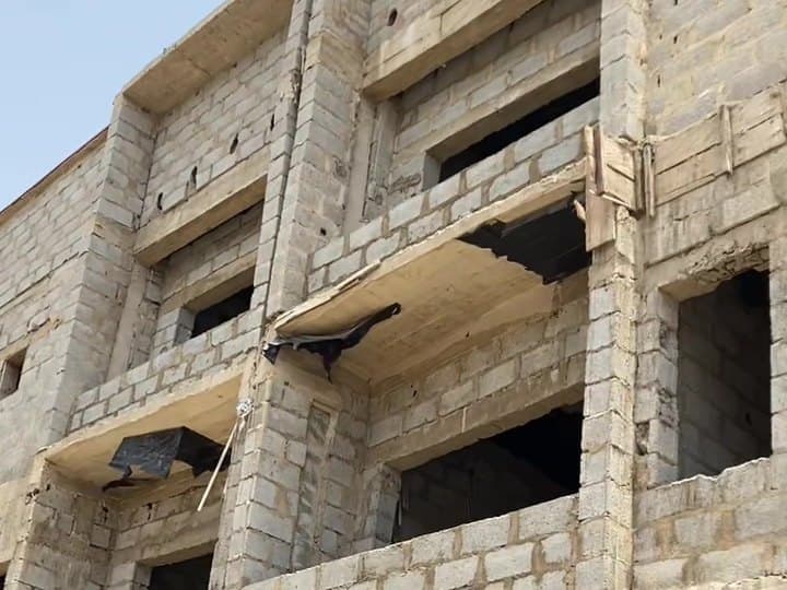A three-storey blockwork carcass awaiting finishes